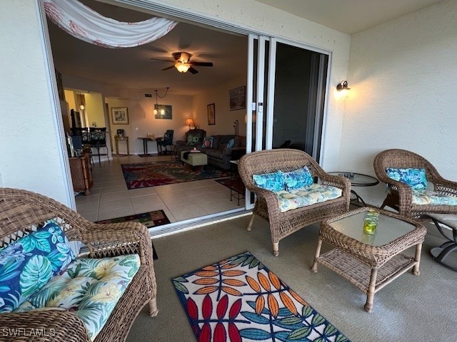 interior space with ceiling fan and carpet