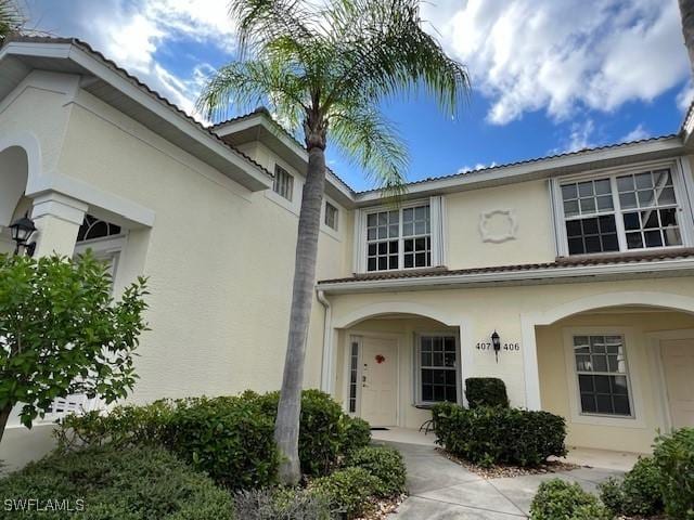 exterior space with covered porch and stucco siding