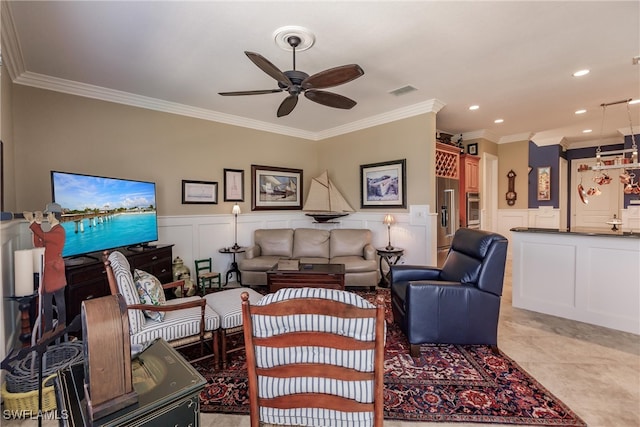 living room with ceiling fan, light tile patterned flooring, and ornamental molding