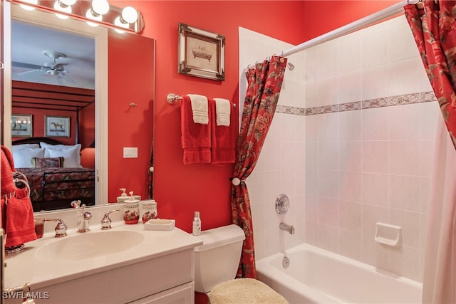 full bathroom featuring ceiling fan, shower / bath combo with shower curtain, vanity, and toilet