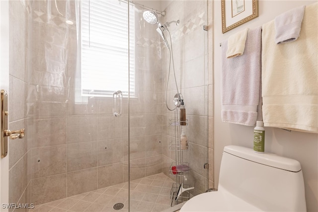 bathroom featuring toilet and walk in shower