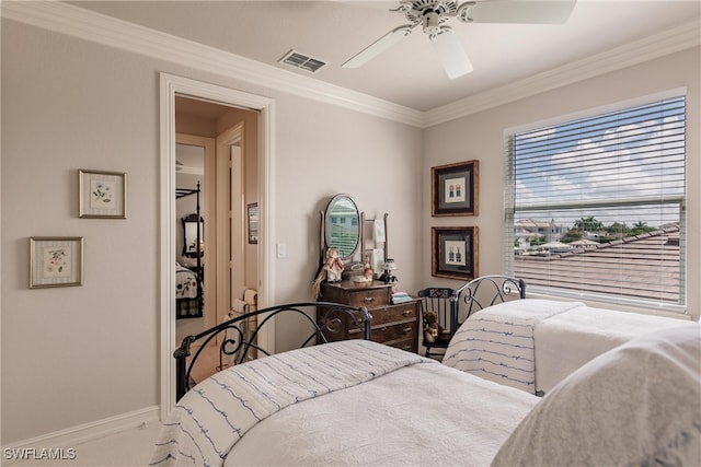 bedroom with carpet floors, ceiling fan, and ornamental molding