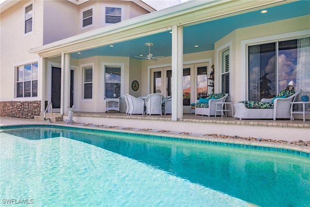 view of pool featuring ceiling fan and a patio area