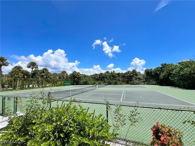 view of tennis court with fence