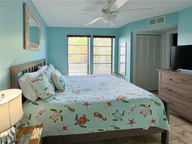 bedroom with ceiling fan and a closet