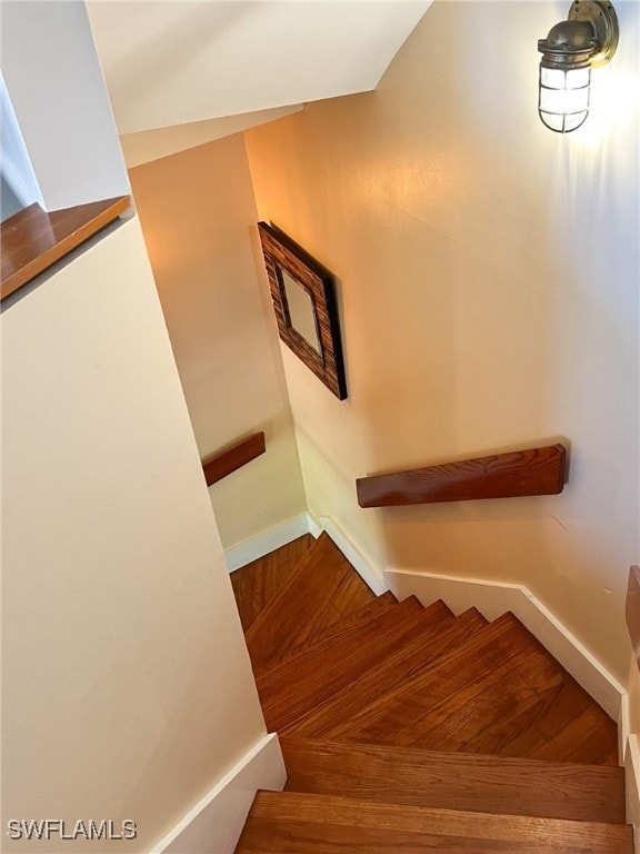 stairway with wood-type flooring