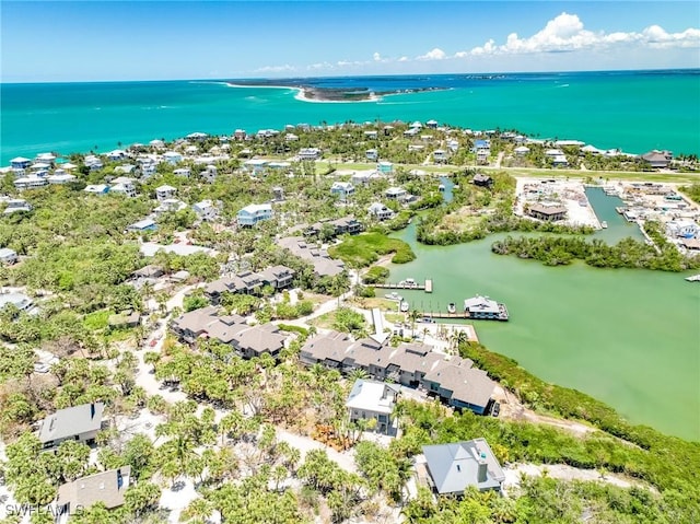 aerial perspective of suburban area featuring a nearby body of water