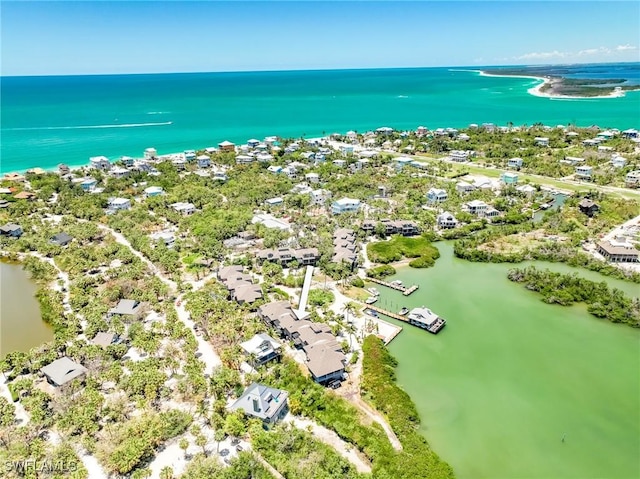 aerial view of residential area with a large body of water