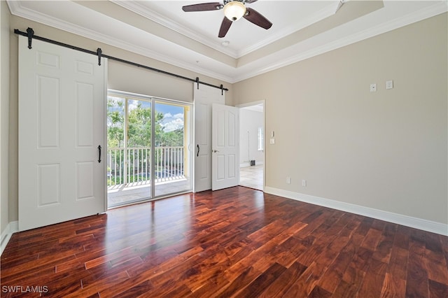 empty room with crown molding, dark hardwood / wood-style floors, and ceiling fan