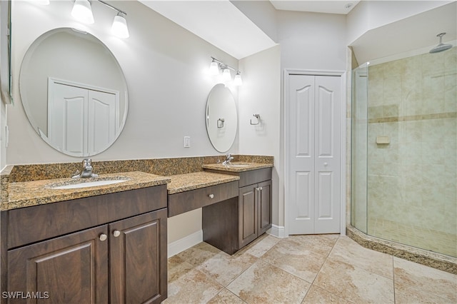 bathroom featuring vanity and an enclosed shower