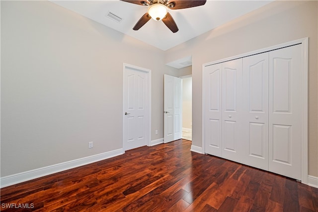 unfurnished bedroom with a closet, ceiling fan, and dark hardwood / wood-style flooring