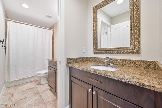 bathroom featuring toilet, visible vents, and vanity