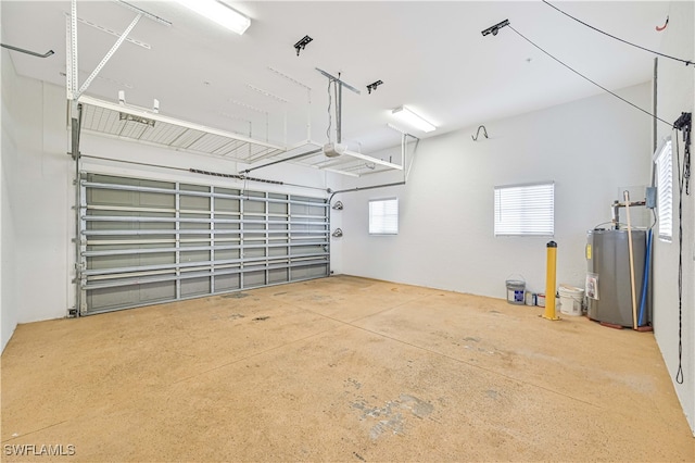 garage with a garage door opener and water heater