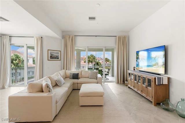 living room with light tile patterned flooring