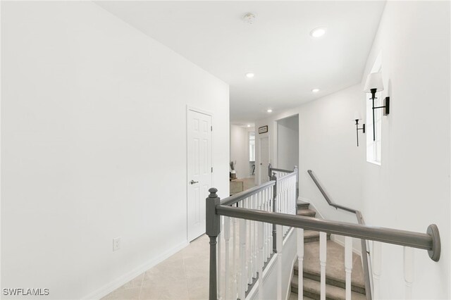 hall featuring light tile patterned floors