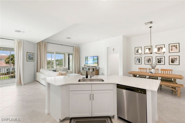 kitchen with pendant lighting, white cabinetry, dishwasher, sink, and light tile patterned flooring