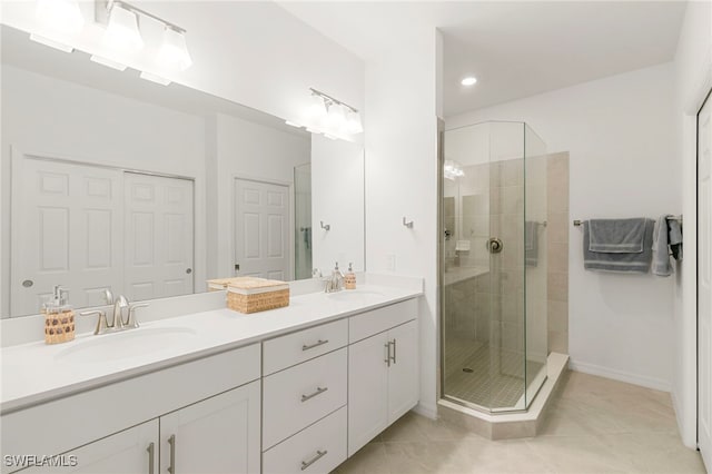 bathroom featuring vanity, tile patterned floors, and walk in shower