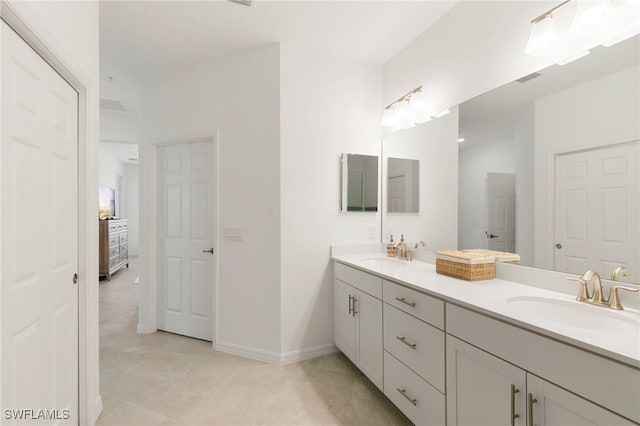 bathroom with vanity and tile patterned floors