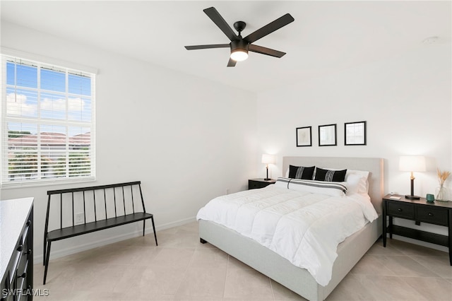 bedroom featuring ceiling fan and light tile patterned flooring