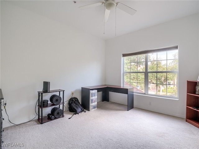 carpeted home office with ceiling fan