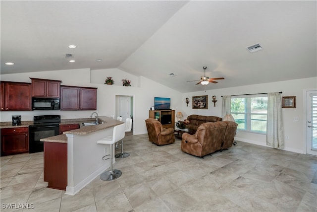 kitchen with vaulted ceiling, black appliances, light tile patterned floors, a kitchen island with sink, and ceiling fan