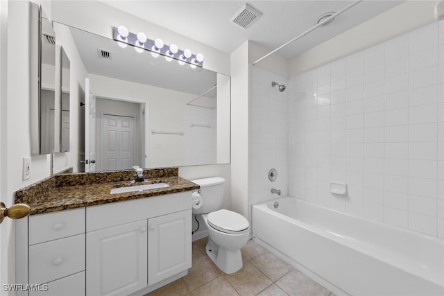 full bathroom featuring tile patterned flooring, vanity, tiled shower / bath combo, and toilet