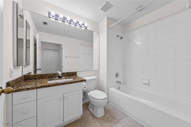 full bathroom featuring tile patterned flooring, toilet, vanity, visible vents, and washtub / shower combination