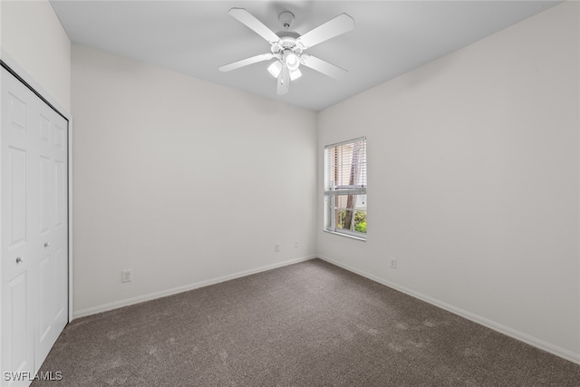 unfurnished bedroom with carpet, a closet, and ceiling fan