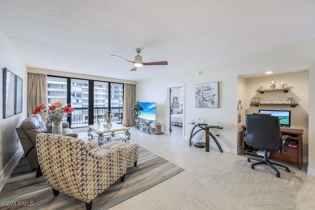 tiled living room with ceiling fan and floor to ceiling windows