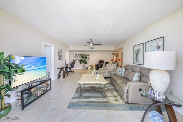 tiled living room featuring ceiling fan