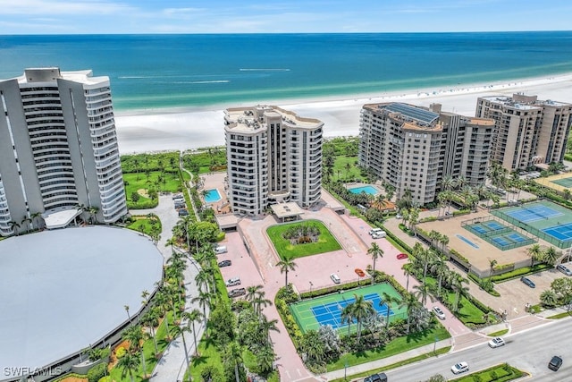 aerial view featuring a view of the beach and a water view