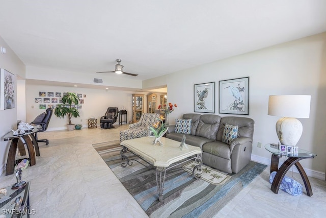 tiled living room with ceiling fan