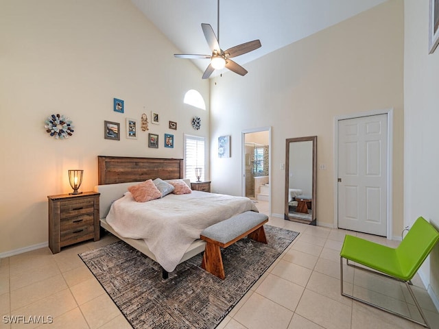 bedroom featuring ensuite bath, light tile patterned floors, high vaulted ceiling, and ceiling fan