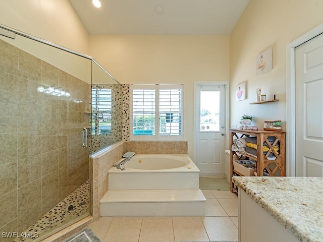 bathroom featuring shower with separate bathtub and tile patterned floors