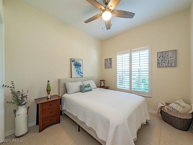 bedroom with ceiling fan and light tile patterned floors