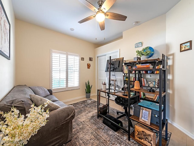 office space featuring ceiling fan and tile patterned floors