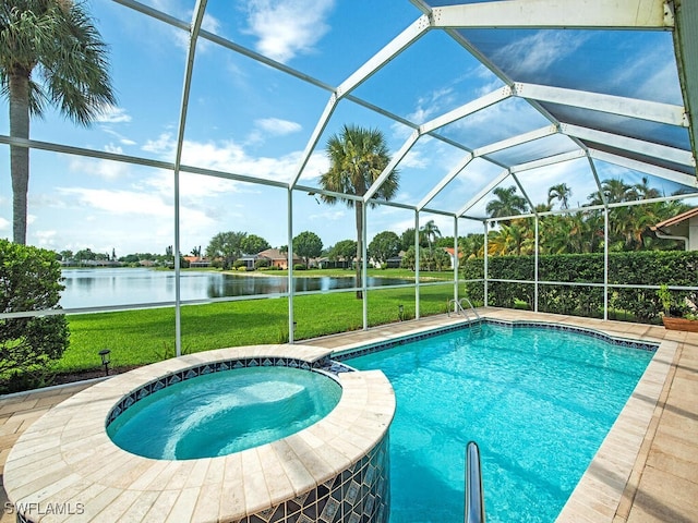 view of swimming pool with a lanai, a lawn, and a water view