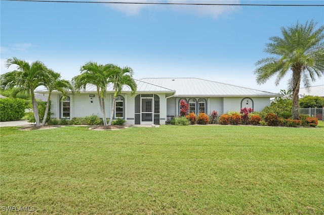 ranch-style home with a front yard