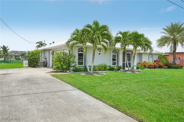 ranch-style home featuring a front yard