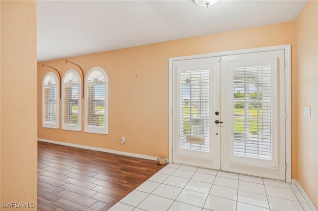 entryway featuring french doors and light hardwood / wood-style flooring