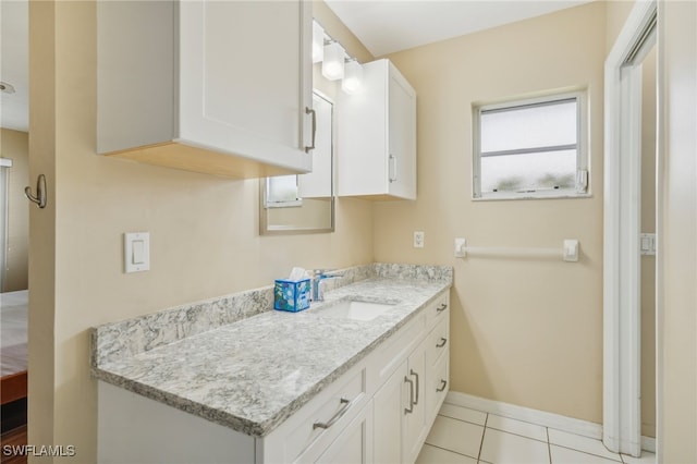 bathroom with tile patterned flooring and vanity