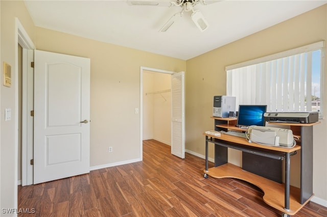 office area featuring dark wood-type flooring and ceiling fan