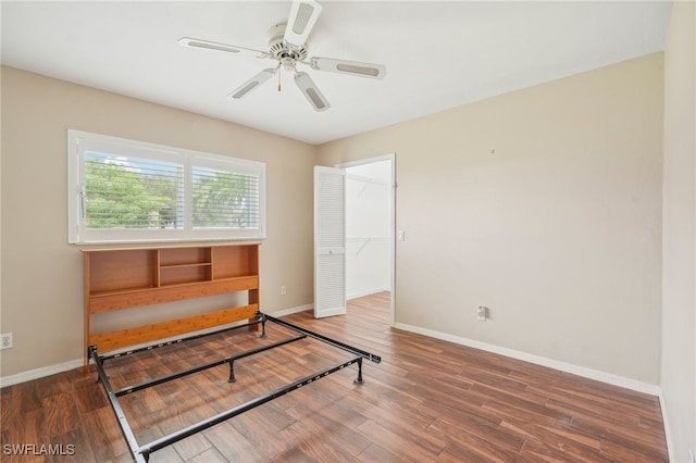 bedroom with a closet, ceiling fan, and hardwood / wood-style floors