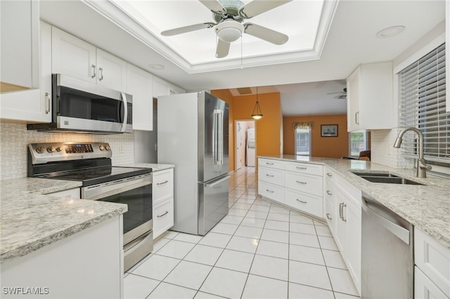 kitchen with ceiling fan, stainless steel appliances, pendant lighting, and sink