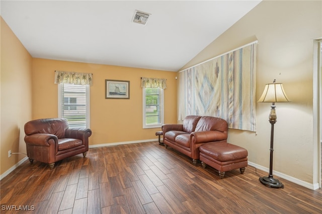 sitting room featuring lofted ceiling and dark hardwood / wood-style floors