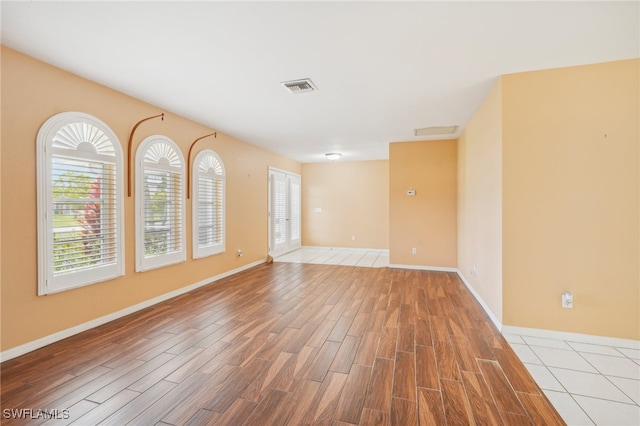 empty room with hardwood / wood-style floors