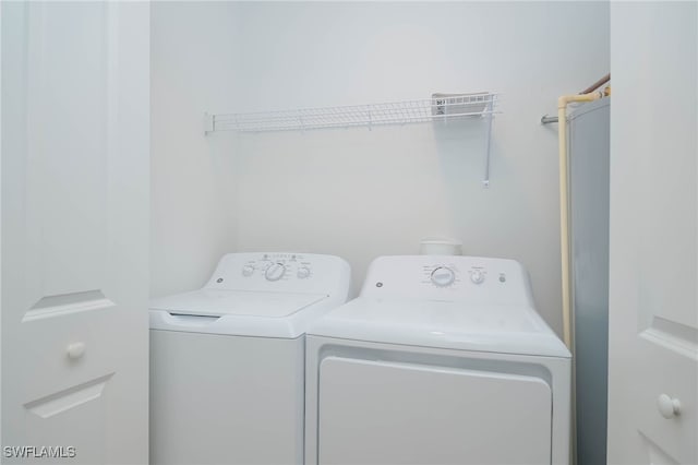 laundry room featuring washing machine and clothes dryer