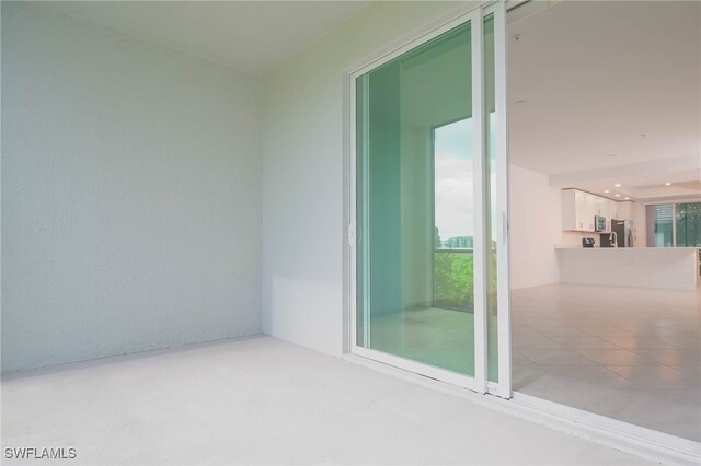 spare room with tile patterned flooring