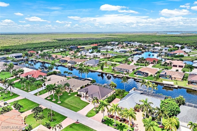 bird's eye view featuring a residential view and a water view