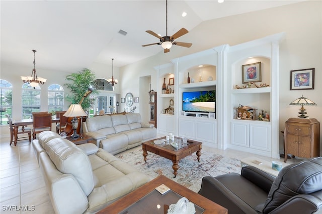 living room with visible vents, ceiling fan with notable chandelier, built in features, light tile patterned flooring, and vaulted ceiling